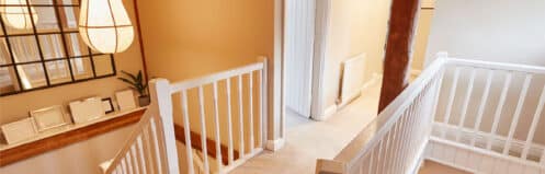 Warm upstairs hallway in a two-story Summerlin home while the AC runs downstairs