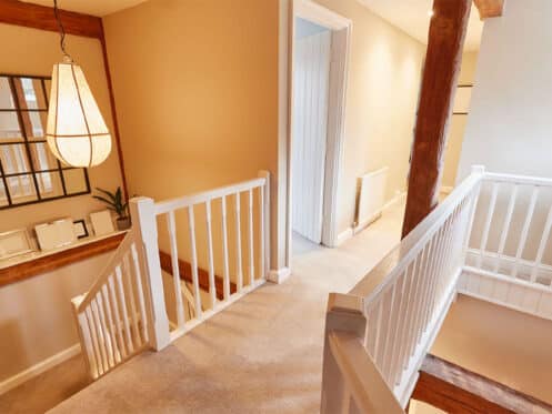 Warm upstairs hallway in a two-story Summerlin home while the AC runs downstairs