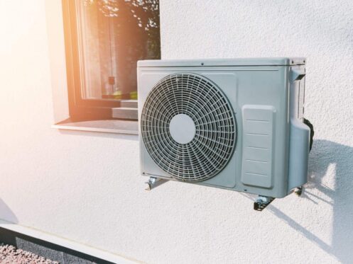 Henderson NV outdoor AC condenser unit running during a summer heat wave