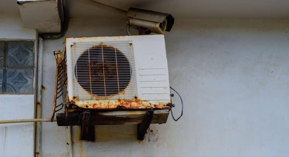 Dilapidated Air Conditioner on Side of Building in Las Vegas