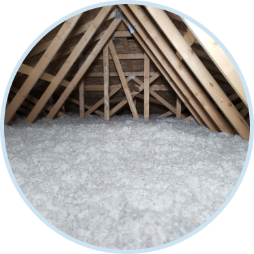Attic upgraded with blown in insulation services to improve home energy efficiency