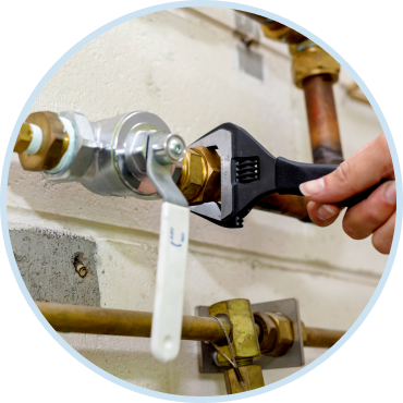 Professional gas line repair service securing pipe connection in home